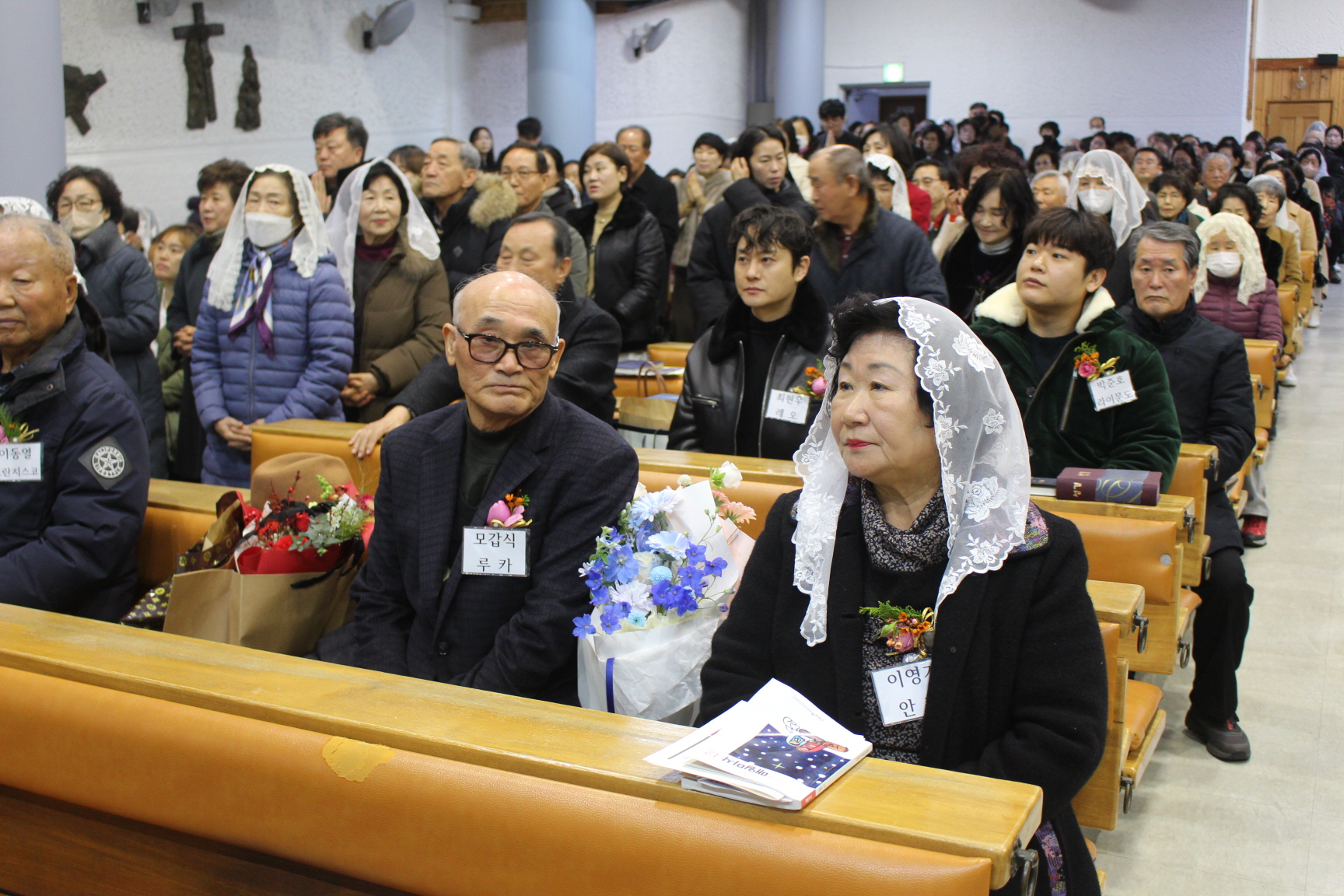 251225 성탄대축일 낮미사_세례자분들 (16).JPG