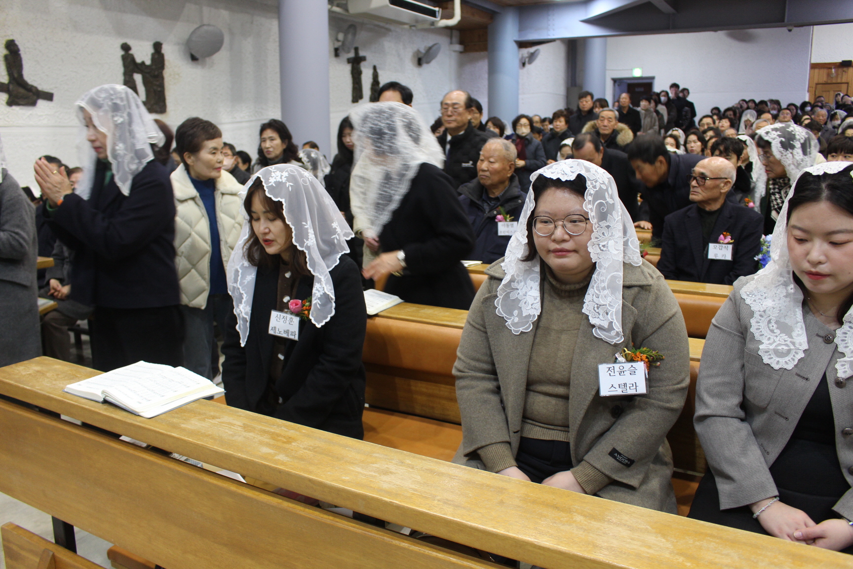 251225 성탄대축일 낮미사_세례자분들 (12).JPG